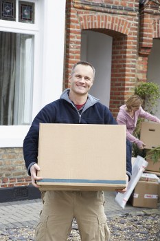 Man with van loading furniture in Old Ford street
