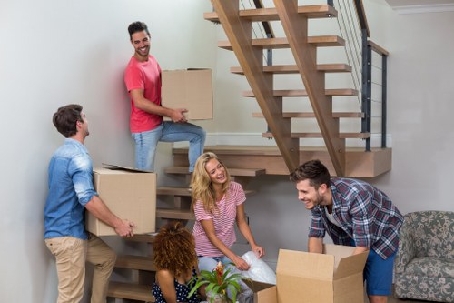 Van removals team handling a business move in Old Ford