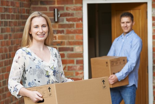 Professional movers loading household items for an Old Ford move