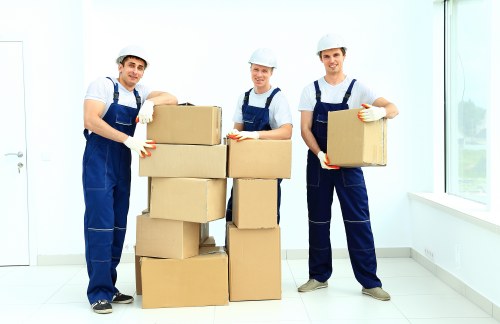 Packed boxes and furniture being loaded into a van in East London