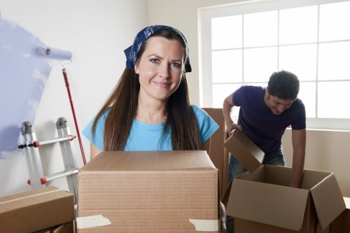 Packed boxes and furniture prepared for moving van transport