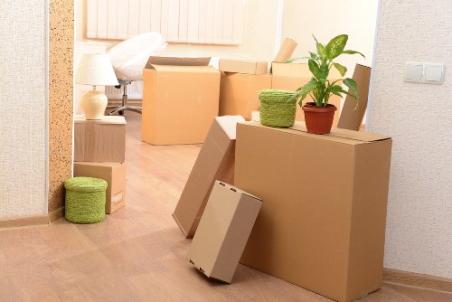 Office desks, IT equipment, and boxes prepared for relocation in Old Ford